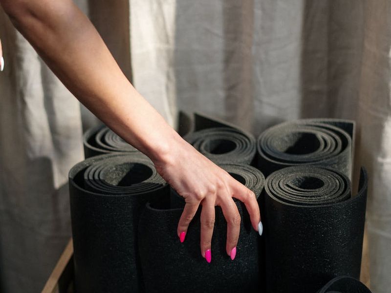 Person performing a flowing yoga transition on a mat.